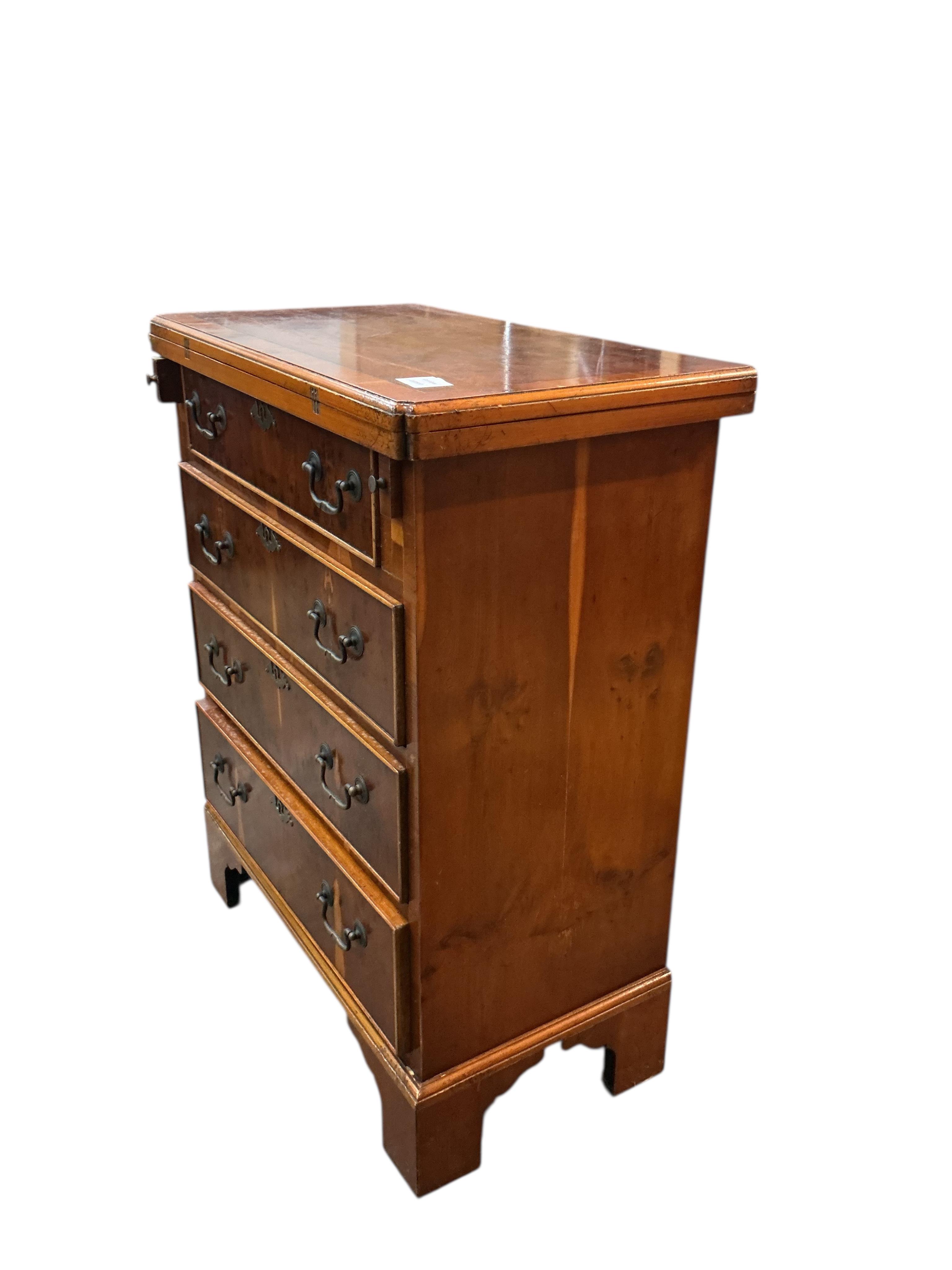 A small reproduction yew bachelor's chest, width 59cm, depth 34cm, height 76cm